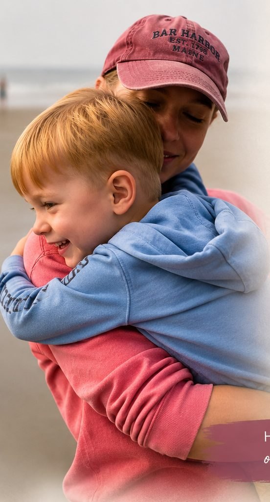 Keri-Lynn Yonika carrying a smiling young child on her back outdoors.